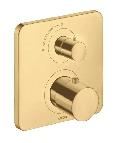 Thermostat-Panel in gebürsteter Goldoptik mit zwei Bedienelementen, hergestellt von AXOR. Die Oberfläche ist matt und hat eine quadratische Form.
